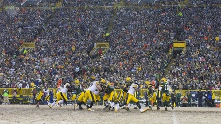 Dec 22, 2013; Green Bay, WI, USA; Green Bay Packers quarterback Matt Flynn (10) drops back to pass during the second quarter against the Pittsburgh Steelers at Lambeau Field. Mandatory Credit: Jeff Hanisch-USA TODAY Sports
