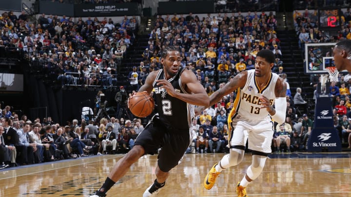 INDIANAPOLIS, IN – MARCH 7: Kawhi Leonard #2 of the San Antonio Spurs drives against Paul George #13 of the Indiana Pacers during the game at Bankers Life Fieldhouse on March 7, 2016 in Indianapolis, Indiana. The Pacers defeated the Spurs 99-91. NOTE TO USER: User expressly acknowledges and agrees that, by downloading and or using the photograph, User is consenting to the terms and conditions of the Getty Images License Agreement. (Photo by Joe Robbins/Getty Images)