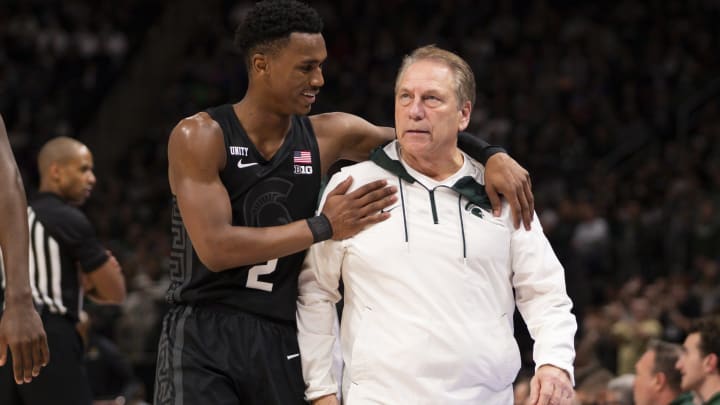 Dec 21, 2021; Detroit, Michigan, USA; Michigan State Spartans guard Tyson Walker (2) tries to calm down head coach Tom Izzo after getting a technical foul during the second half against the Oakland Golden Grizzlies at Little Caesars Arena. Mandatory Credit: Raj Mehta-USA TODAY Sports