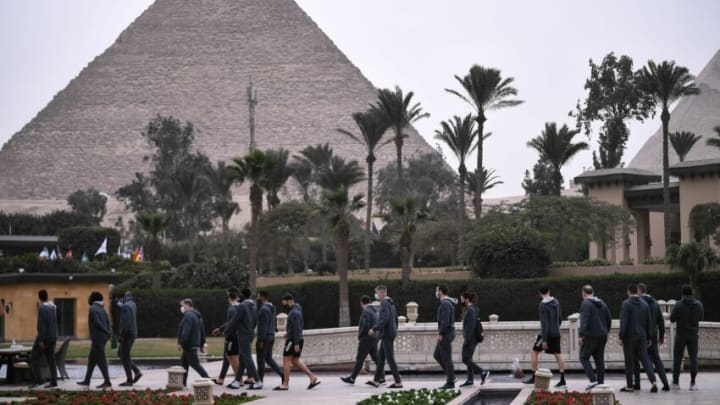 France's national team players walk in their hotel in front of Giza Pyramids, on January 13, 2021 in the Egyptian capital Cairo on the eve of the 2021 World Men's Handball Championship match between Group E teams Norway and France. (Photo by Anne-Christine POUJOULAT / AFP) (Photo by ANNE-CHRISTINE POUJOULAT/AFP via Getty Images)