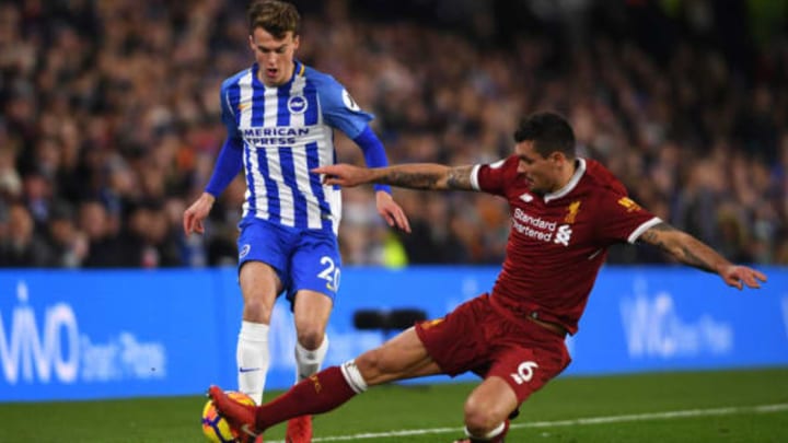 Solly March of Brighton and Hove Albion is challenged by Dejan Lovren of Liverpool during the Premier League match between Brighton and Hove Albion and Liverpool at Amex Stadium. (Pic by Mike Hewitt by Getty Images)