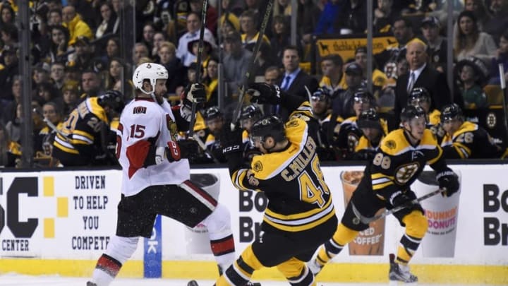 Apr 9, 2016; Boston, MA, USA; Ottawa Senators center Zack Smith (15) collides with Boston Bruins defenseman Colin Miller (48) during the second period at TD Garden. Mandatory Credit: Bob DeChiara-USA TODAY Sports