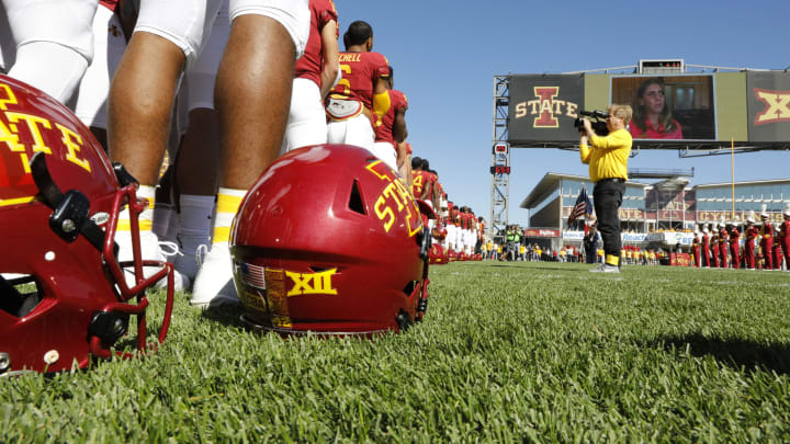 AMES, IA – SEPTEMBER 22: During a pre-game moment of silence the Iowa State Cyclones and the Akron Zips wear CBA helmet decals to honor Celia Barquin Arozamena, (pictured on the jumbotron), at Jack Trice Stadium on September 22, 2018 in Ames, Iowa. Celia Barquin Arozamena, Iowa States 2018 Big 12 Women’s Golf Champion, was murdered Monday September 17th while playing golf on a course near the college. (Photo by David Purdy/Getty Images)