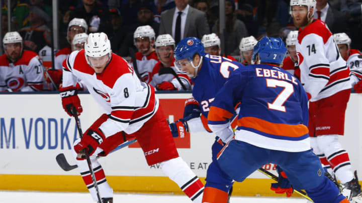 UNIONDALE, NEW YORK - JANUARY 08: Saku Maenalanen #8 of the Carolina Hurricanes carries the puck against the New York Islanders during the second period at Nassau Veterans Memorial Coliseum on January 08, 2019 in Uniondale, New York. (Photo by Mike Stobe/NHLI via Getty Images)