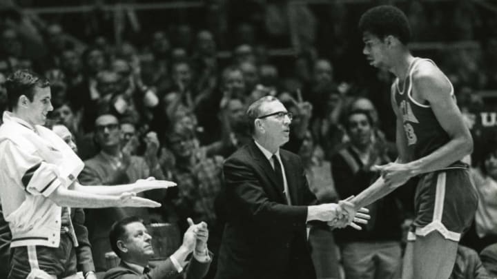 Unknown date & location, USA: FILE PHOTO; UCLA Bruins center Lew Alcindor (33) later known as Kareem Abdul-Jabbar shakes head coach John Wooden hand as he comes off the court. Mandatory Credit: Malcolm Emmons- USA TODAY Sports