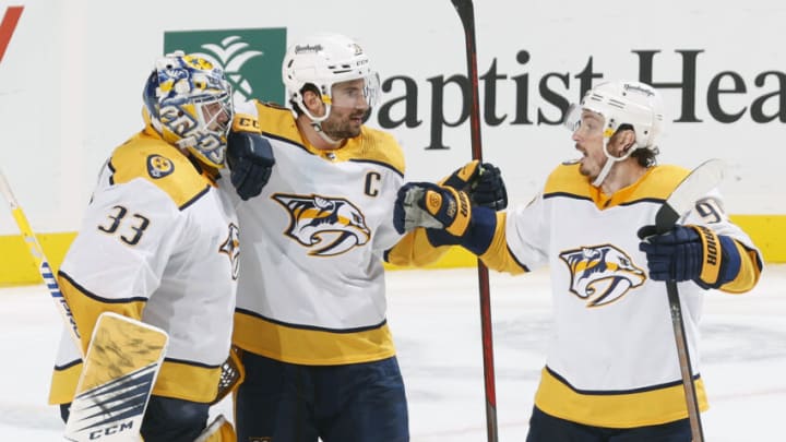 SUNRISE, FL - FEBRUARY 22: Goaltender David Rittich #33 celebrates the victory with Roman Josi #59 and Matt Duchene #95 of the Nashville Predators over the Florida Panthers at the FLA Live Arena on February 22, 2022 in Sunrise, Florida. The Predators defeated the Panthers 6-4. (Photo by Joel Auerbach/Getty Images)