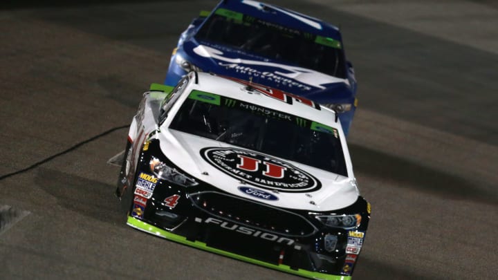 RICHMOND, VA – SEPTEMBER 22: Kevin Harvick, driver of the #4 Jimmy John’s New 9-Grain Wheat Sub Ford, leads Martin Truex, driver of the #78 Auto-Owners Insurance Toyota (Photo by Sean Gardner/Getty Images)