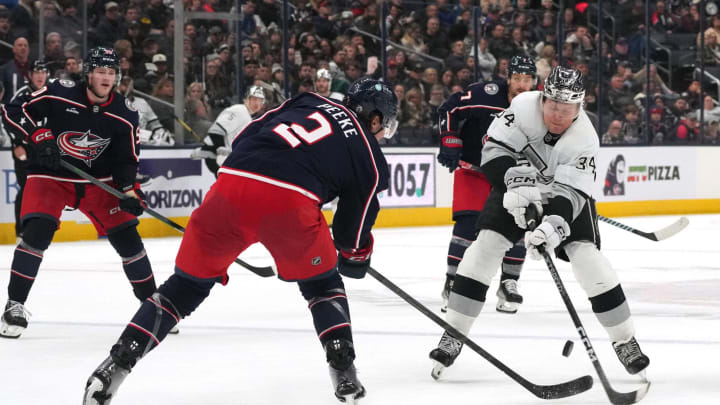 COLUMBUS, OHIO – DECEMBER 05: Arthur Kaliyev #34 of the Los Angeles Kings shoots the puck against Andrew Peeke #2 of the Columbus Blue Jackets during the third period at Nationwide Arena on December 05, 2023 in Columbus, Ohio. (Photo by Jason Mowry/Getty Images)