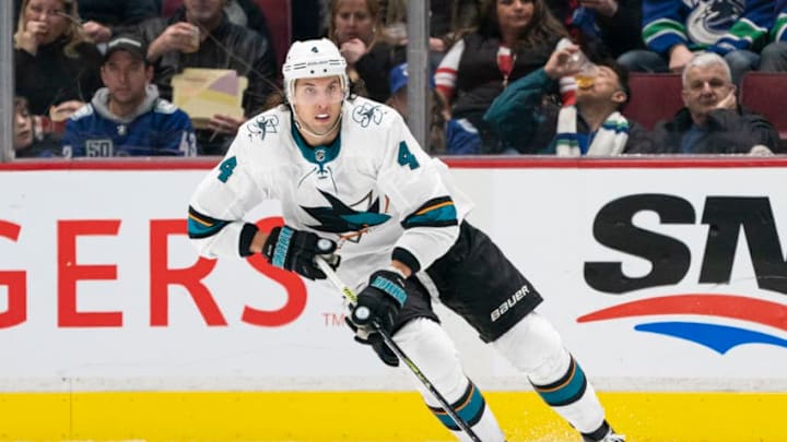 VANCOUVER, BC - JANUARY 18: Brenden Dillon #4 of the San Jose Sharks skates with the puck during NHL action against the Vancouver Canucks at Rogers Arena on January 18, 2020 in Vancouver, British Columbia, Canada. (Photo by Rich Lam/Getty Images)