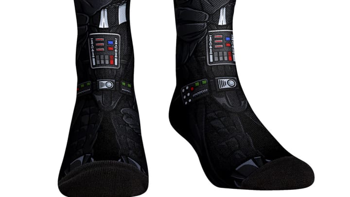 Darth Vader (Cracked Helmet) Socks by Rock ‘Em Socks. Image courtesy StarWars.com