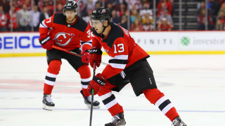 NEWARK, NJ - OCTOBER 04: New Jersey Devils center Nico Hischier (13) skates during the National Hockey League game between the New Jersey Devils and the Winnipeg Jets on October 4, 2019 at the Prudential Center in Newark, NJ. (Photo by Rich Graessle/Icon Sportswire via Getty Images)