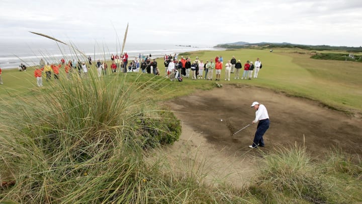 BANDON, OR – JULY 30: Amanda Blumenherst of the United States hits out of the Bunker on the 4th hole en route to losing her match with teammate Paige Mackenzie 1 UP to Martina Gillen and Naomi Edwards of Great Britain and Ireland during the morning foursome competition of the 34th Curtis Cup Match on July 30, 2006 at Pacific Dunes part of Bandon Dunes Golf Resort in Bandon, Oregon. (Photo by Jonathan Ferrey/Getty Images)