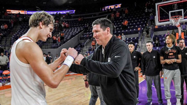 Clemson forward Hunter Tyson (5) and Clemson Head Coach Brad Brownell celebrate after the 101-94 two overtime win over Penn State University at Littlejohn Coliseum Tuesday, November 29, 2022.Clemson Basketball Vs Penn State University Acc Big 10 Challenge
