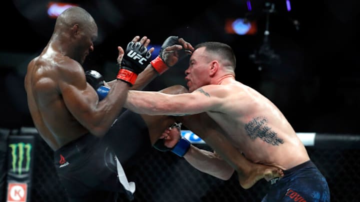 LAS VEGAS, NEVADA - DECEMBER 14: UFC welterweight champion Kamaru Usman (L) kicks Colby Covington in their welterweight title fight during UFC 245 at T-Mobile Arena on December 14, 2019 in Las Vegas, Nevada. Usman retained his title with a fifth-round TKO. (Photo by Steve Marcus/Getty Images)