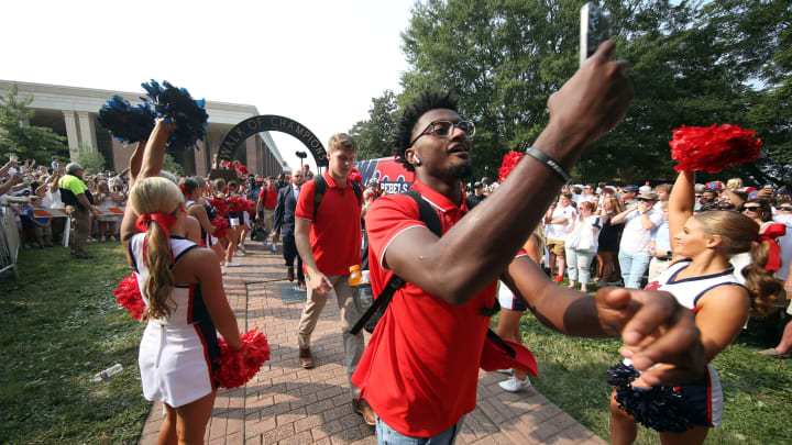 Sep 11, 2021; Oxford, Mississippi, USA; Mississippi Rebels defensive back Keidron Smith takes a selfie as he makes his way down the Walk of Champions before their game against the Austin Peay Governors at Vaught-Hemingway Stadium. Mandatory Credit: Petre Thomas-USA TODAY Sports