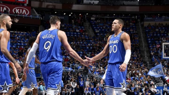 ORLANDO, FL - OCTOBER 17: Nikola Vucevic #9 and Aaron Gordon #00 of the Orlando Magic high five during the game against the Miami Heat on October 17, 2018 at Amway Center in Orlando, Florida. NOTE TO USER: User expressly acknowledges and agrees that, by downloading and/or using this photograph, user is consenting to the terms and conditions of the Getty Images License Agreement. Mandatory Copyright Notice: Copyright 2018 NBAE (Photo by Fernando Medina/NBAE via Getty Images)