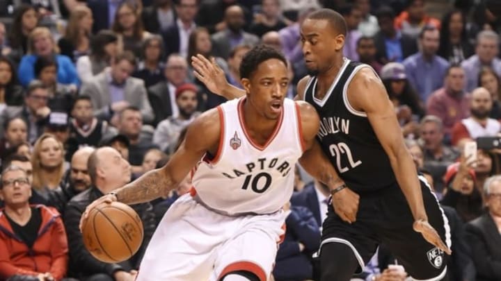 Mar 8, 2016; Toronto, Ontario, CAN; Toronto Raptors guard DeMar DeRozan (10) dribbles the ball past Brooklyn Nets guard Markel Brown (22) in the first half at Air Canada Centre. The Raptors won 104-99. Mandatory Credit: Dan Hamilton-USA TODAY Sports