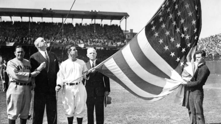 WASHINGTON - APRIL, 1925. On opening day at Griffith Stadium in Washington, D.C. in 1925, the flag raising ceremony involved Yankee manager Joe McCarthy, far right, Washington manager Bucky Harris, third from right, and Senators owner Calvin Griffith, fourth from right. (Photo by Mark Rucker/Transcendental Graphics, Getty Images)