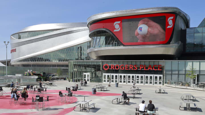 EDMONTON, ALBERTA - AUGUST 10: Players and staff watch the second phase of the NHL draft lottery as they sit in the recreation area outside Rogers Place on August 10, 2020 during the 2020 NHL Stanley Cup Playoffs in Edmonton, Alberta, Canada. The New York Rangers won the first pick. (Photo by Jeff Vinnick/Getty Images)