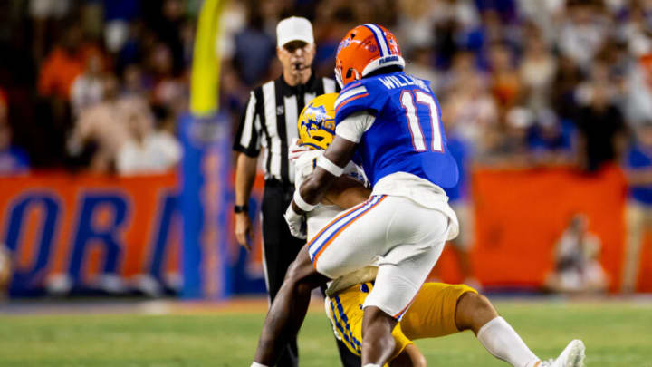 Sep 9, 2023; Gainesville, Florida, USA; Florida Gators linebacker Scooby Williams (17) sacks McNeese State Cowboys quarterback Nate Glantz (18) during the first half at Ben Hill Griffin Stadium. Mandatory Credit: Matt Pendleton-USA TODAY Sports