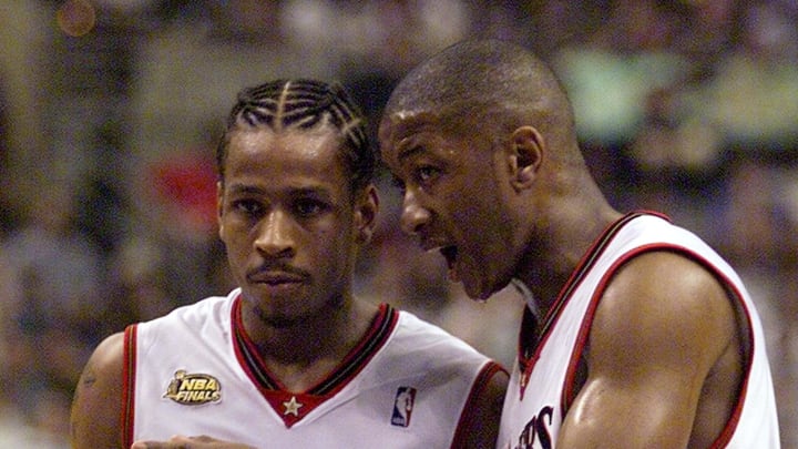 PHILADELPHIA, UNITED STATES: Philadelphia 76ers Allen Iverson (L) and Eric Snow (R) talk during the second quarter of game four of the NBA Finals 13 June, 2001 at First Union Center in Philadelphia, PA. The Lakers lead the best-of-seven game series 2-1. AFP PHOTO/Jeff HAYNES (Photo credit should read JEFF HAYNES/AFP/Getty Images)