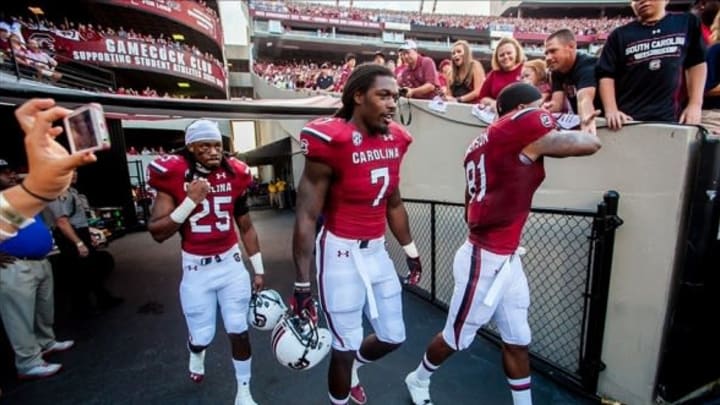 Sep 14, 2013; Columbia, SC, USA; South Carolina Gamecocks safety Kadetrix Marcus (25) and South Carolina Gamecocks defensive end Jadeveon Clowney (7) and South Carolina Gamecocks tight end Rory Anderson (81) walk onto the field for the coin flip against the Vanderbilt Commodores at Williams-Brice Stadium. Mandatory Credit: Jeff Blake-USA TODAY Sports