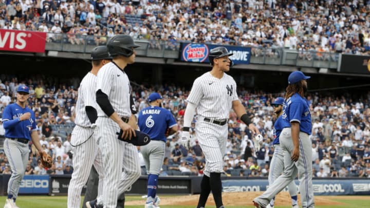 NEW YORK, NEW YORK - AUGUST 21: Aaron Judge #99 of the New York Yankees walks to first base after he was hit by a pitch from Alek Manoah #6 of the Toronto Blue Jays during the fifth inning at Yankee Stadium on August 21, 2022 in New York City. (Photo by Jim McIsaac/Getty Images)