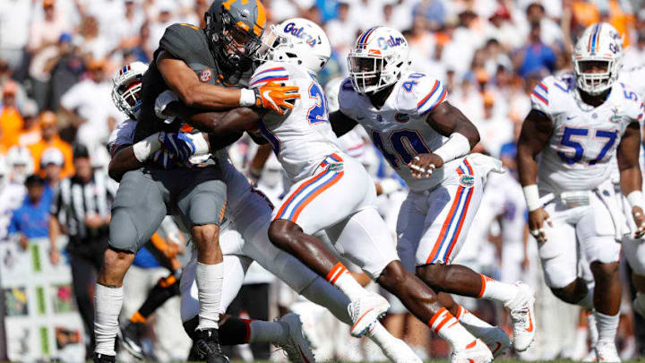 KNOXVILLE, TN - SEPTEMBER 24: Marcus Maye No. 20 and Jarrad Davis No. 40 of the Florida Gators tackle Jalen Hurd No. 1 of the Tennessee Volunteers during the game at Neyland Stadium on September 24, 2016 in Knoxville, Tennessee. Tennessee defeated Florida 38-28. (Photo by Joe Robbins/Getty Images)