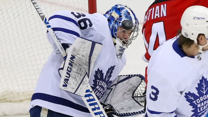 Toronto Maple Leafs goaltender Jack Campbell (36) makes a save with his mask against New Jersey Devils during the third period at Prudential Center. Mandatory Credit: Tom Horak-USA TODAY Sports