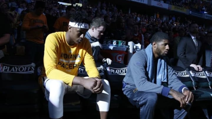 Apr 23, 2016; Indianapolis, IN, USA; Indiana Pacers center Myles Turner (33) and forward Paul George (13) wait to be introduced before the game against the Toronto Raptors in game four of the first round of the 2016 NBA Playoffs at Bankers Life Fieldhouse. Mandatory Credit: Brian Spurlock-USA TODAY Sports