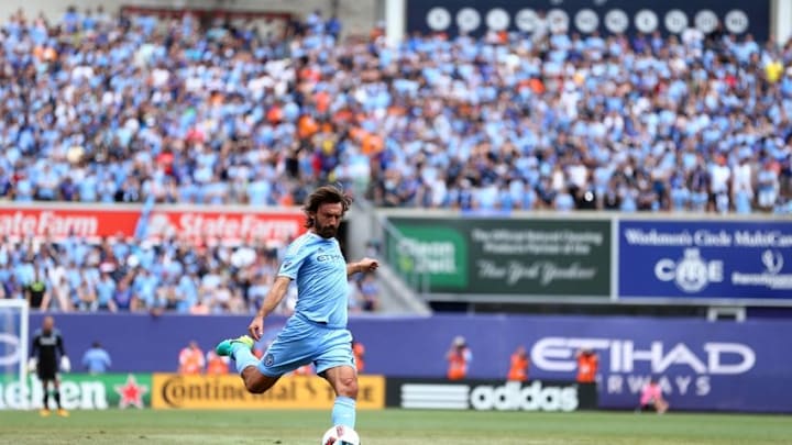 Jul 3, 2016; New York, NY, USA; New York City FC midfielder Andrea Pirlo (21) kicks a free kick against the New York Red Bulls during the first half at Yankee Stadium. Mandatory Credit: Brad Penner-USA TODAY Sports