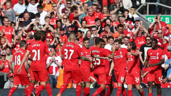 LIVERPOOL, ENGLAND - MAY 08: Joe Allen of Liverpool (2R) celebrates with his team mates after scoring his side's first goal during the Barclays Premier League match between Liverpool and Watford at Anfield on May 8, 2016 in Liverpool, England. (Photo by Jan Kruger/Getty Images)