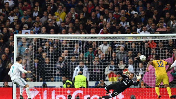 MADRID, SPAIN - APRIL 11: Cristiano Ronaldo of Real Madrid scores his sides first goal during the UEFA Champions League Quarter Final Second Leg match between Real Madrid and Juventus at Estadio Santiago Bernabeu on April 11, 2018 in Madrid, Spain. (Photo by David Ramos/Getty Images)