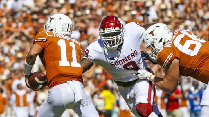 Oct 9, 2021; Dallas, Texas, USA; Oklahoma Sooners defensive lineman Perrion Winfrey (8) pressures Texas Longhorns quarterback Casey Thompson (11) during the game at the Cotton Bowl. Mandatory Credit: Kevin Jairaj-USA TODAY Sports