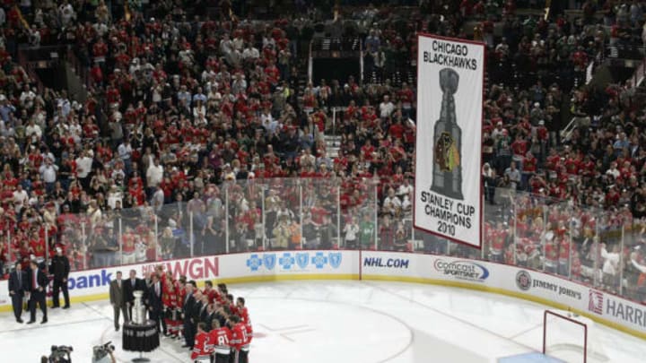 CHICAGO – OCTOBER 09: The Chicago Blackhawks get their photo taken as the 2010 Stanley Cup Championship banner is raised into the rafters before the game against the Detroit Red Wings on October 09, 2010 at the United Center in Chicago, Illinois. (Photo by Bill Smith/NHLI via Getty Images)