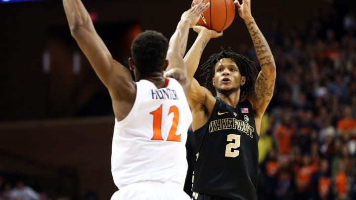 CHARLOTTESVILLE, VA – JANUARY 22: Sharone Wright Jr. #2 of the Wake Forest Demon Deacons shoots over De’Andre Hunter #12 of the Virginia Cavaliers in the first half during a game at John Paul Jones Arena on January 22, 2019 in Charlottesville, Virginia. (Photo by Ryan M. Kelly/Getty Images)