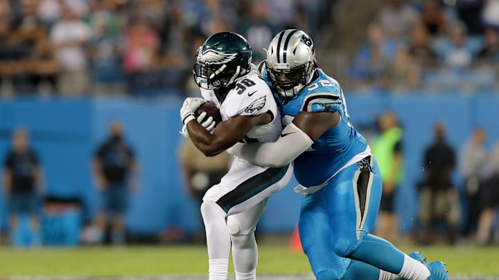 CHARLOTTE, NC – OCTOBER 12: Vernon Butler #92 of the Carolina Panthers tackles Kenjon Barner #38 of the Philadelphia Eagles in the first quarter during their game at Bank of America Stadium on October 12, 2017 in Charlotte, North Carolina. (Photo by Streeter Lecka/Getty Images)