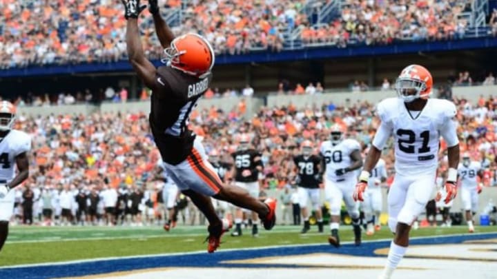 Aug 2, 2014; Akron, OH, USA; Cleveland Browns wide receiver Taylor Gabriel (18) is unable to make a catch in the end zone while being defended by cornerback Justin Gilbert (21) during training camp at InfoCision Stadium Summa Field. Mandatory Credit: Andrew Weber-USA TODAY Sports
