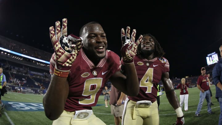 Sep 5, 2016; Orlando, FL, USA; Florida State Seminoles running back Jacques Patrick (9) and running back Dalvin Cook (4) celebrate after they beat the Mississippi Rebels at Camping World Stadium. Florida State Seminoles defeated the Mississippi Rebels 45-34. Mandatory Credit: Kim Klement-USA TODAY Sports