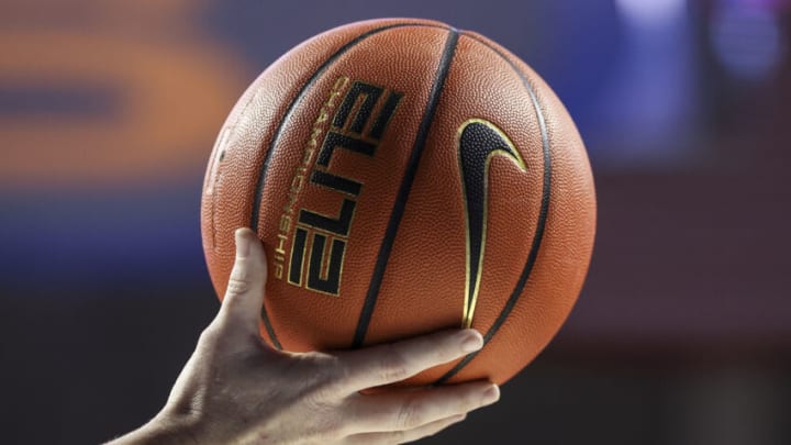 GAINESVILLE, FLORIDA - DECEMBER 08: A Referee holds a Nike Basketball during the second half of a game between the Florida Gators and the Dayton Flyers at the Stephen C. O'Connell Center on December 08, 2021 in Gainesville, Florida. (Photo by James Gilbert/Getty Images)