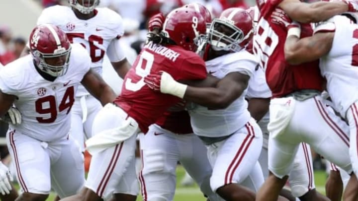 Apr 16, 2016; Tuscaloosa, AL, USA; Alabama Crimson Tide defensive lineman Dalvin Tomlinson (54) wraps up Alabama Crimson Tide running back Bo Scarbrough (9) at Bryant-Denny Stadium. Mandatory Credit: Marvin Gentry-USA TODAY Sports