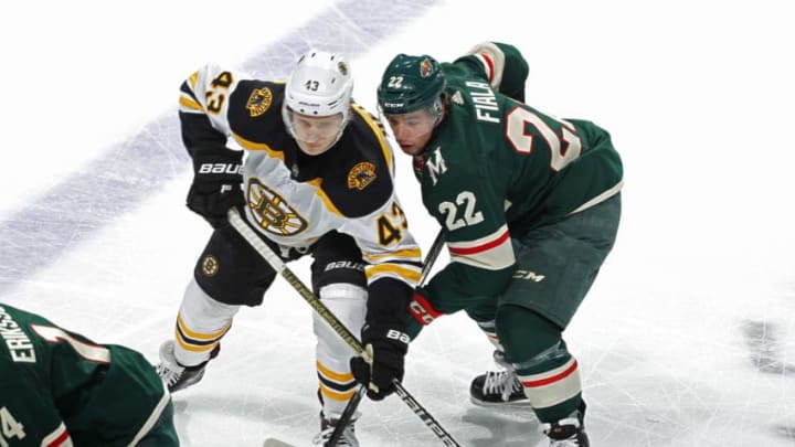 ST. PAUL, MN - APRIL 04: Danton Heinen #43 of the Boston Bruins and Kevin Fiala #22 of the Minnesota Wild battle for position during a game at Xcel Energy Center on April 4, 2019 in St. Paul, Minnesota.(Photo by Bruce Kluckhohn/NHLI via Getty Images)