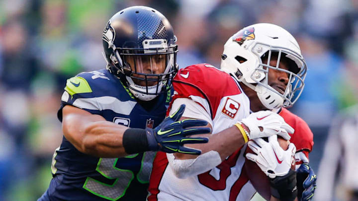 SEATTLE, WA - DECEMBER 30: Bobby Wagner #54 of the Seattle Seahawks tackles David Johnson #31 of the Arizona Cardinals in the third quarter at CenturyLink Field on December 30, 2018 in Seattle, Washington. (Photo by Otto Greule Jr/Getty Images)