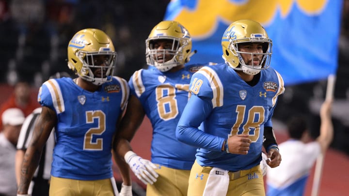 PHOENIX, AZ – DECEMBER 26: Quarterback Devon Modster #18 of the UCLA Bruins celebrates a touchdown with wide receiver Jordan Lasley #2 and tight end Jordan Wilson #87 in the first half of the Cactus Bowl against the Kansas State Wildcats at Chase Field on December 26, 2017 in Phoenix, Arizona. (Photo by Jennifer Stewart/Getty Images)
