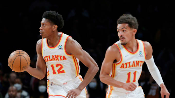 NEW YORK, NEW YORK - NOVEMBER 03: De'Andre Hunter #12 of the Atlanta Hawks dribbles during the first half against the Brooklyn Nets at Barclays Center on November 03, 2021 in the Brooklyn borough of New York City. NOTE TO USER: User expressly acknowledges and agrees that, by downloading and or using this photograph, user is consenting to the terms and conditions of the Getty Images License Agreement. (Photo by Sarah Stier/Getty Images)