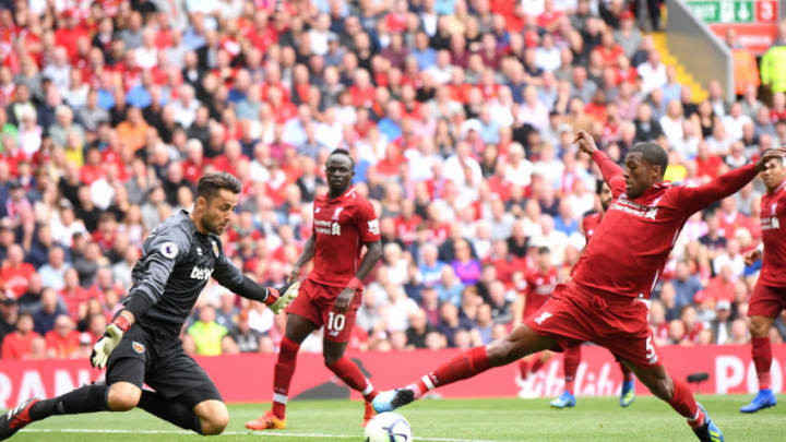 LIVERPOOL, ENGLAND - AUGUST 12: Georginio Wijnaldum of Liverpool battles for possession with Lukasz Fabianski of West Ham United during the Premier League match between Liverpool FC and West Ham United at Anfield on August 12, 2018 in Liverpool, United Kingdom. (Photo by Laurence Griffiths/Getty Images)