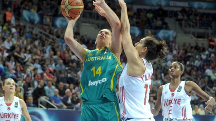 Australia's Marianna Tolo (L) vies for the ball with Turkey's Nevriye Yilmaz (R-2nd) during the 2014 FIBA Women's World Championships 3rd place basketball match between Turkey and Australia at Fenerbahce Ulker Sports Arena on October 5, 2014 in Istanbul. AFP PHOTO / OZAN KOSE (Photo credit should read OZAN KOSE/AFP/Getty Images)