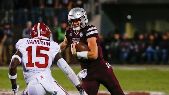 STARKVILLE, MS - NOVEMBER 11: Nick Fitzgerald #7 of the Mississippi State Bulldogs carries the ball as he tries to get around Ronnie Harrison #15 of the Alabama Crimson Tide during the first half of an NCAA football game at Davis Wade Stadium on November 11, 2017 in Starkville, Mississippi. (Photo by Butch Dill/Getty Images)