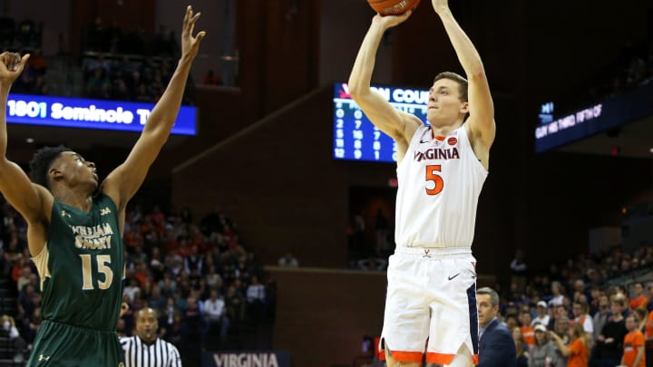 CHARLOTTESVILLE, VA – DECEMBER 22: Kyle Guy #5 of the Virginia Cavaliers shoots over Chase Audige #15 of the William & Mary Tribe in the second half during a game at John Paul Jones Arena on December 22, 2018 in Charlottesville, Virginia. (Photo by Ryan M. Kelly/Getty Images)