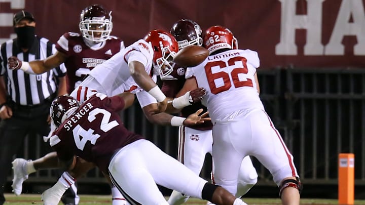 STARKVILLE, MISSISSIPPI – OCTOBER 03: Marquiss Spencer #42 of the Mississippi State Bulldogs forces a fumble on Feleipe Franks #13 of the Arkansas Razorbacks during the first half at Davis Wade Stadium on October 03, 2020 in Starkville, Mississippi. (Photo by Jonathan Bachman/Getty Images)